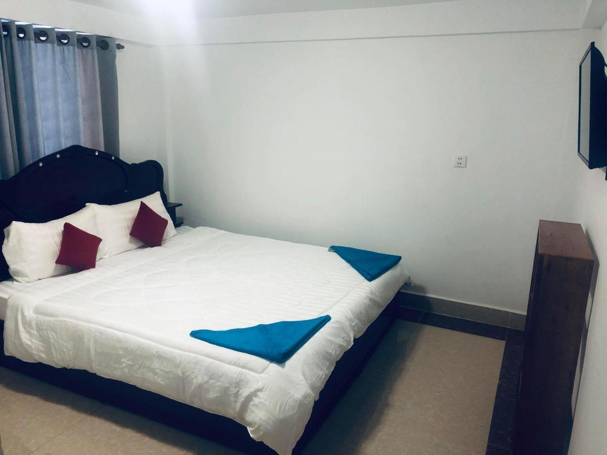 Ez Guesthouse Phnom Penh Bagian luar foto